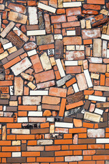 Brown rectangle bricks create an orange brickwork art on the wall