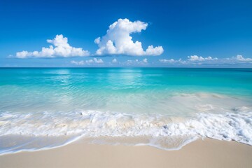 Obraz premium Tranquil panoramic view of the serene and pristine turquoise ocean with crystal-clear waters, gentle waves, and a white sandy shore, creating a tranquil scene under a blue sky in a tropical paradise