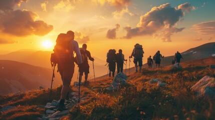 Fototapeta premium Hikers on a mountain trail at sunset