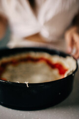 Beautiful woman in the kitchen preparing food. 