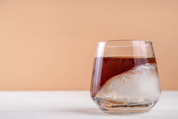 Cognac or whiskey with ice, strong alcoholic cocktail