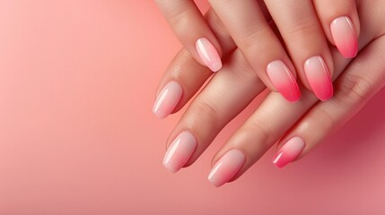 Gradient nail art and spa treatment for hands Close up of woman s elegant hands with manicure and soft skin Baby boomer nail design on woman s nails on pink backdrop Ample space for text
