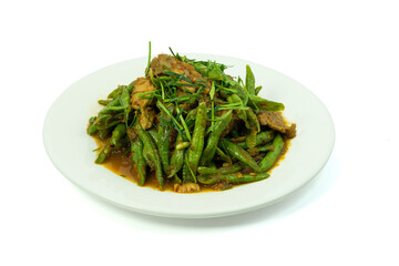 Stir-fried pork and green yard long bean or string bean with red curry paste in white dish isolated on white background with clipping path top view flat lay. Thai food concept.