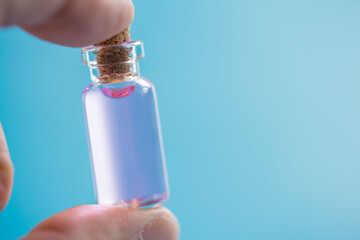 a small bottle of perfume with pheromones that induces sexual attraction