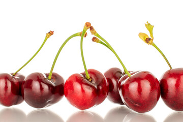 A few sweet cherry berries, macro, isolated on a white background.