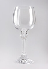 Beautiful large wine lamp on a white background. Transparent wine glass on a white background