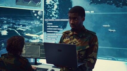 National guard machinist managing cybersecurity measures to protect federal government data from...