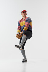Funny meme emotions. Full-length image of young guy, baseball player in position, serving ball, training isolated on white background. Concept of sport, retro and vintage, active lifestyle, hobby