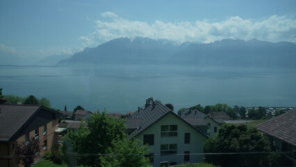 Naklejka premium Panoramic View of Lake Geneva with Alpine Mountains in Background, Switzerland