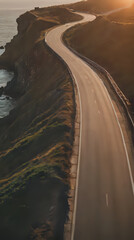 a view of a highway going down a hill near the ocean