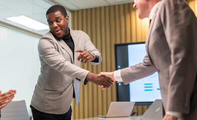 Obraz premium Image two business partner meeting successful handshake together with success join congratulation good deal contract in modern office.Partnership approval and teamwork concept