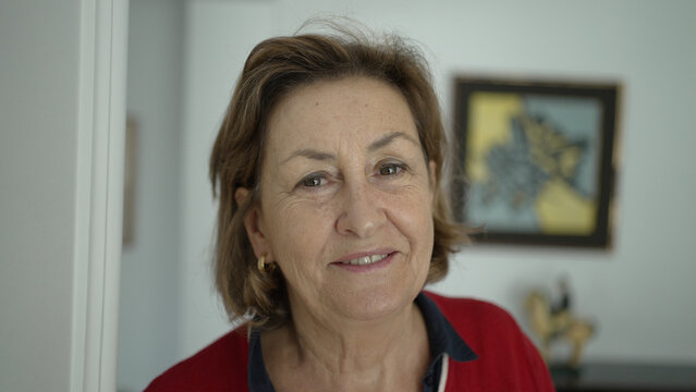 Portrait Of A Smiling Elderly Woman At Home - Warm And Friendly Senior Lady
