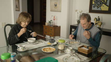Senior Couple Enjoying a Healthy Breakfast Together at Home - Relaxed Morning Meal