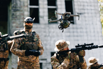 Military operator use rc for controls FPV UAV drone with device for releasing mines and grenades to enemy positions