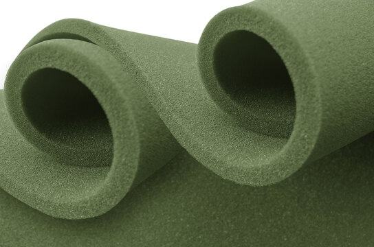 two pastel green foam rolled up in a spiral isolated on a white background
