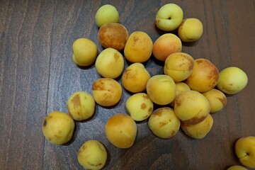 Fresh yellow orange apricots scattered around in a nice pattern