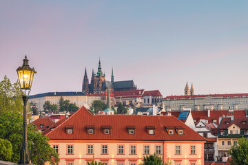 Obraz premium Prague Castle with a lighted lamp early morning before sunrise, Prague, Czech Republic, Europe.