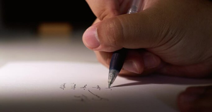 Macro shot of slow motion practicing writing a signature