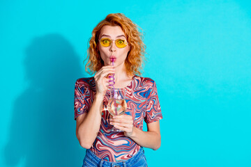 Photo of pretty woman sip cocktail straw wear t-shirt isolated on teal color background