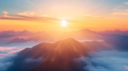The sun is shining on the mountains, creating a beautiful and serene atmosphere. The clouds in the sky add to the sense of peace and tranquility
