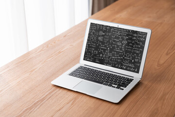 Mathematic equations and modish formula on computer screen showing concept of science and education