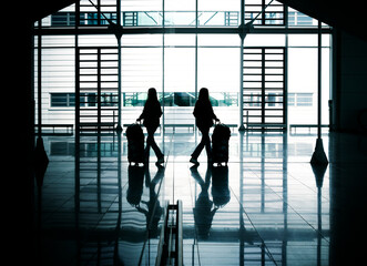 silhouettes of people in the airport