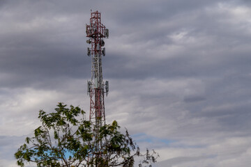 Telecommunication antenna on a blue sky background