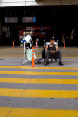 Fototapeta premium Man traveler at airport calls taxi through application on phone.