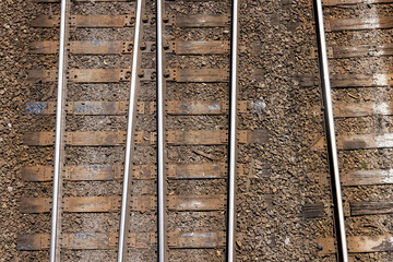 Overhead looking straight down at railroad tracks