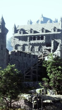 Old ruined castle in the misty mountains
