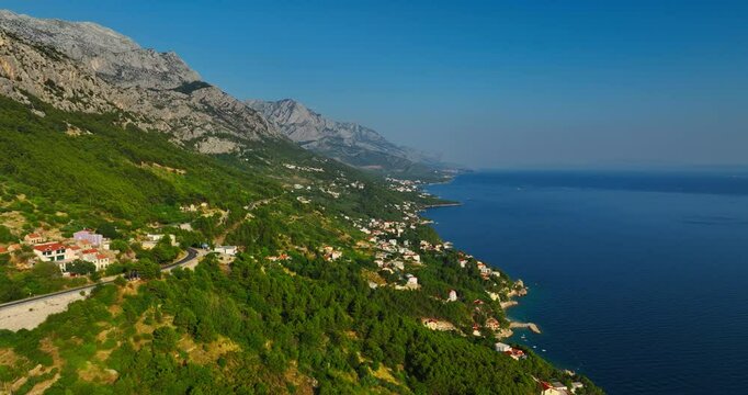 Establishing drone shot of the Makarska riviera coastline in Croatia, summer day
