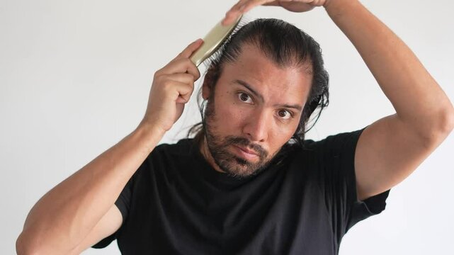 man using brush on his head with baldness, Paddle brush, latino man, hair