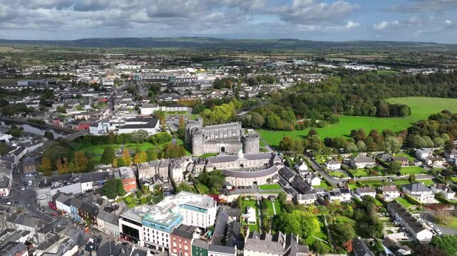 Kilkenny Castle, County Kilkenny, Ireland, September 2023. Drone at a higher angle orbits the estate while gradually descending and pushing closer with views east revealing the elegant formal Gardens.