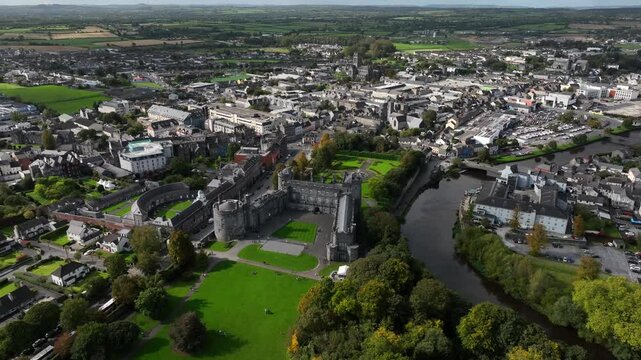 Kilkenny Castle, County Kilkenny, Ireland, September 2023. Drone at a higher angle gradually orbits with St Kieran&rsquo;s College and Saint Mary's Cathedral in the background.
