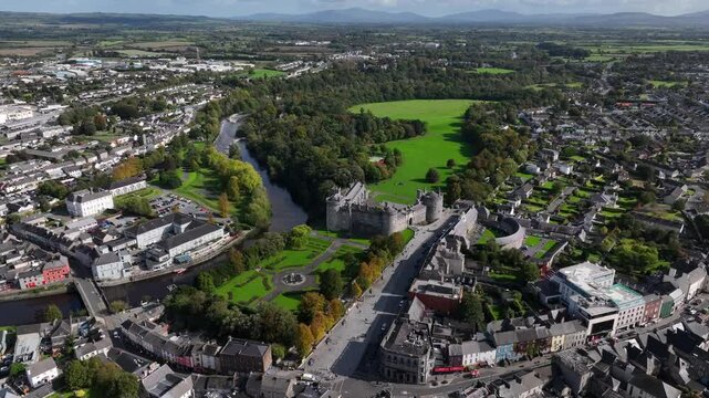 Kilkenny Castle, County Kilkenny, Ireland, September 2023. Drone at a higher angle gradually orbits with the River Nore Mount Leinster and the Blackstairs Mountains of County Carlow in the distance.