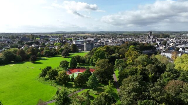 Kilkenny Castle, County Kilkenny, Ireland, September 2023. Drone ascends revealing the Castle and River Nore with St Kieran&rsquo;s College and Saint Mary's Cathedral in the background.