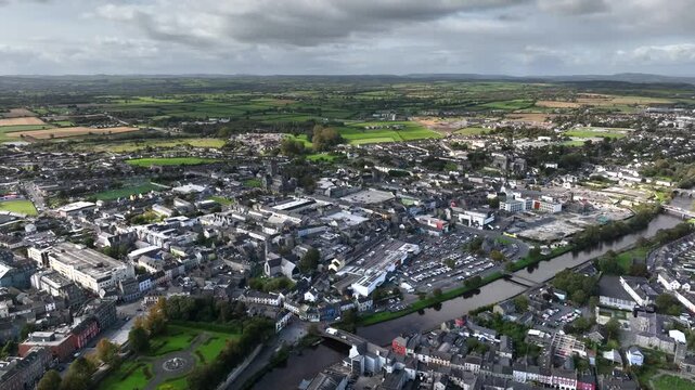 Kilkenny Town, County Kilkenny, Ireland, September 2023. Drone at a higher angle pulls south east across the town revealing views of Kilenny Castle and the River Nore.