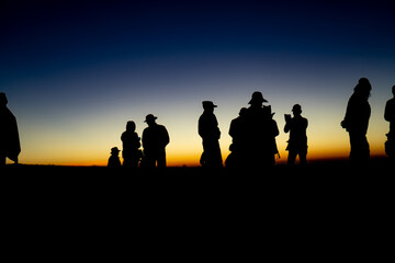 Adventure Friendship at Sunset: Silhouetted Group of Friends Embrace Nature's Beauty, Summer Journey of Hiking and Trekking Together in Majestic Mountain Landscapes, Enjoying Outdoor Activities