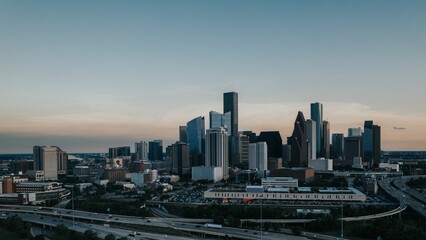 Aerial view of a city skyline with clear sky during sunset