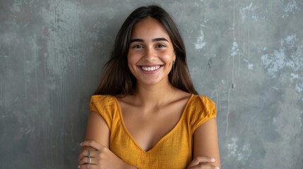 Fototapeta premium Young smiling attractive woman on grey studio background