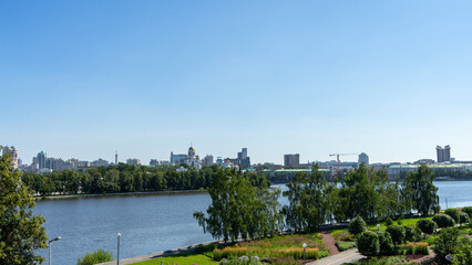 View of embankment of city pond, Iset River, Yekaterinburg, Russia. View from Boris Yeltsin Presidential Center