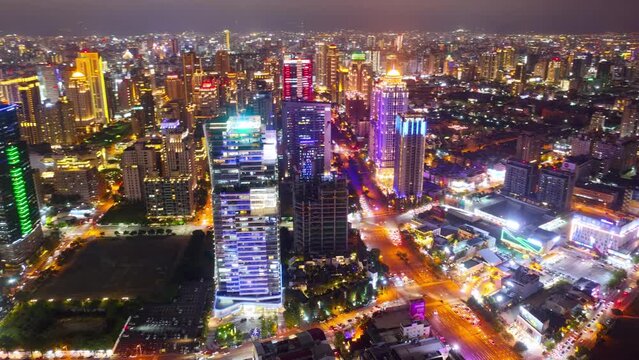 Aerial skyline of Downtown Taichung, a vibrant metropolis in central Taiwan, with modern high-rise office towers booming in the 7th Redevelopment Zone and city lights dazzling at night (in hyperlapse)