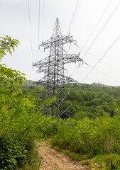 Electric pole in nature in the mountains in summer