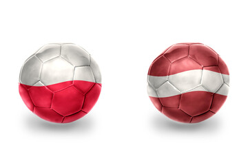 football balls with national flags of latvia and poland ,soccer teams. on the white background.