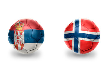 Obraz premium football balls with national flags of norway and serbia ,soccer teams. on the white background.