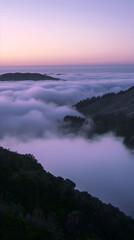 Fototapeta premium Serene Sunrise Over Misty Mountain Landscape