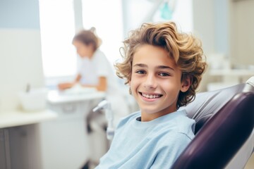 Obraz premium Smiling portrait of a little boy patient at dentist office
