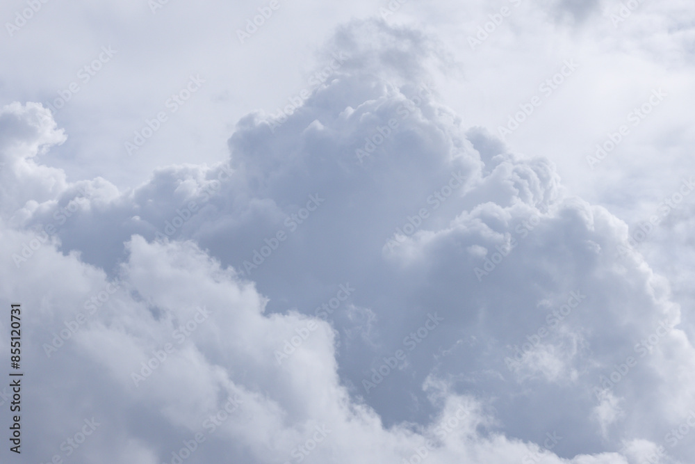 Wall mural a cloudy sky with a large cloud in the middle