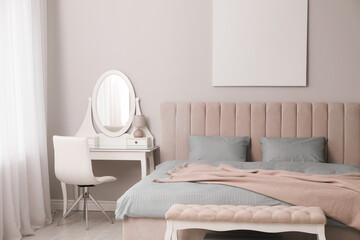 Stylish bedroom with double bed and dressing table. Modern interior