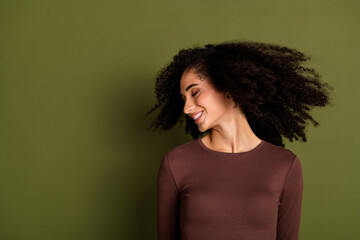 Photo portrait of attractive young woman fluttering hair spa salon dressed stylish brown clothes...